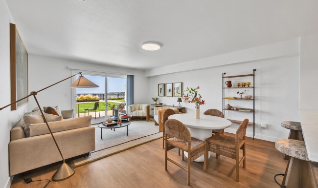 living room with dining table, couch and patio