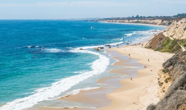 a beach with blue water